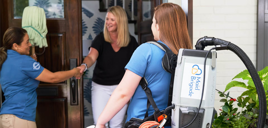 professional house cleaning team arriving at a home