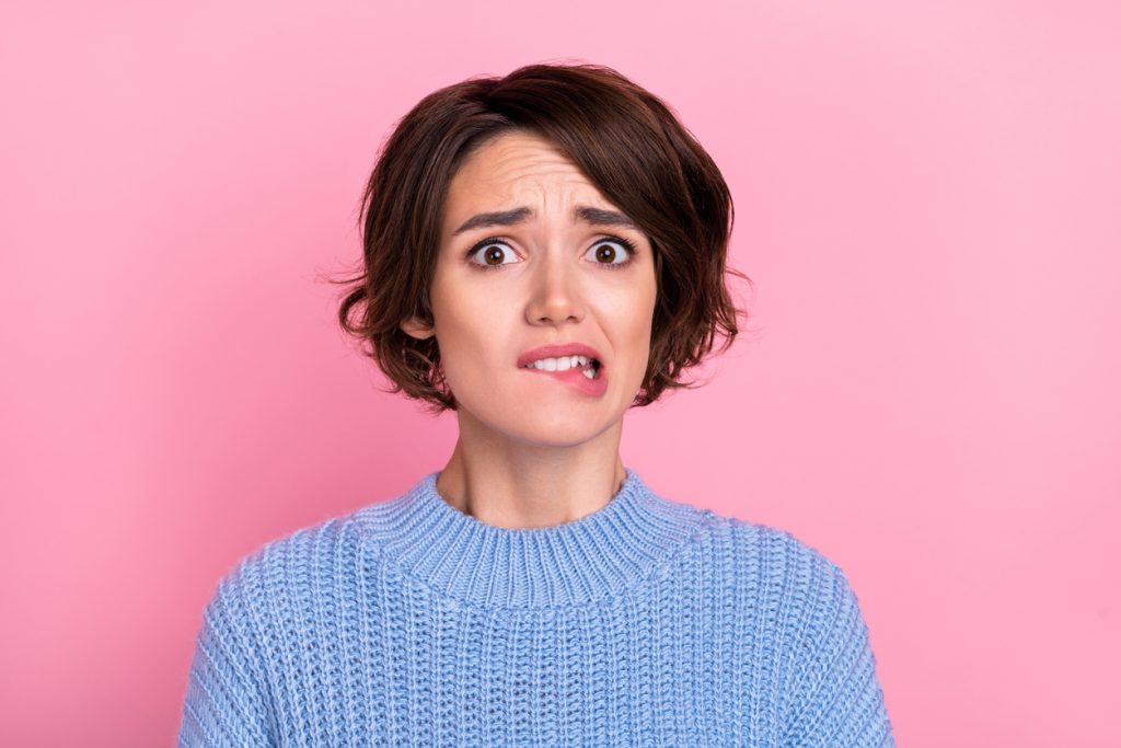 Person looking concerned, representing the feeling of wondering what can go wrong before a house cleaning.