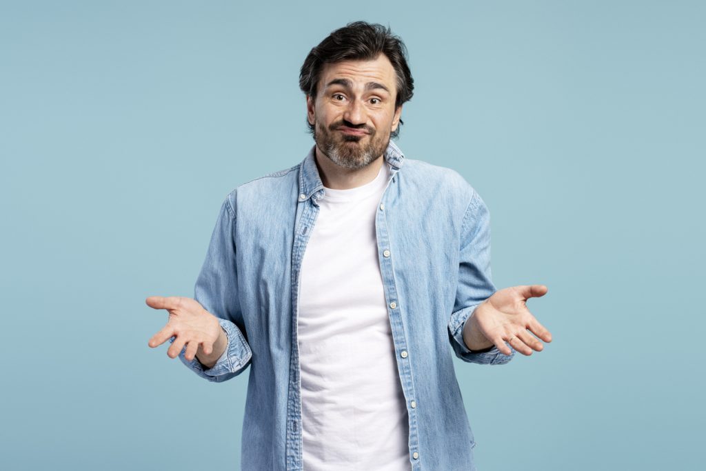 Person shrugging with a puzzled expression, representing confusion about issues that can come up after a house cleaning.