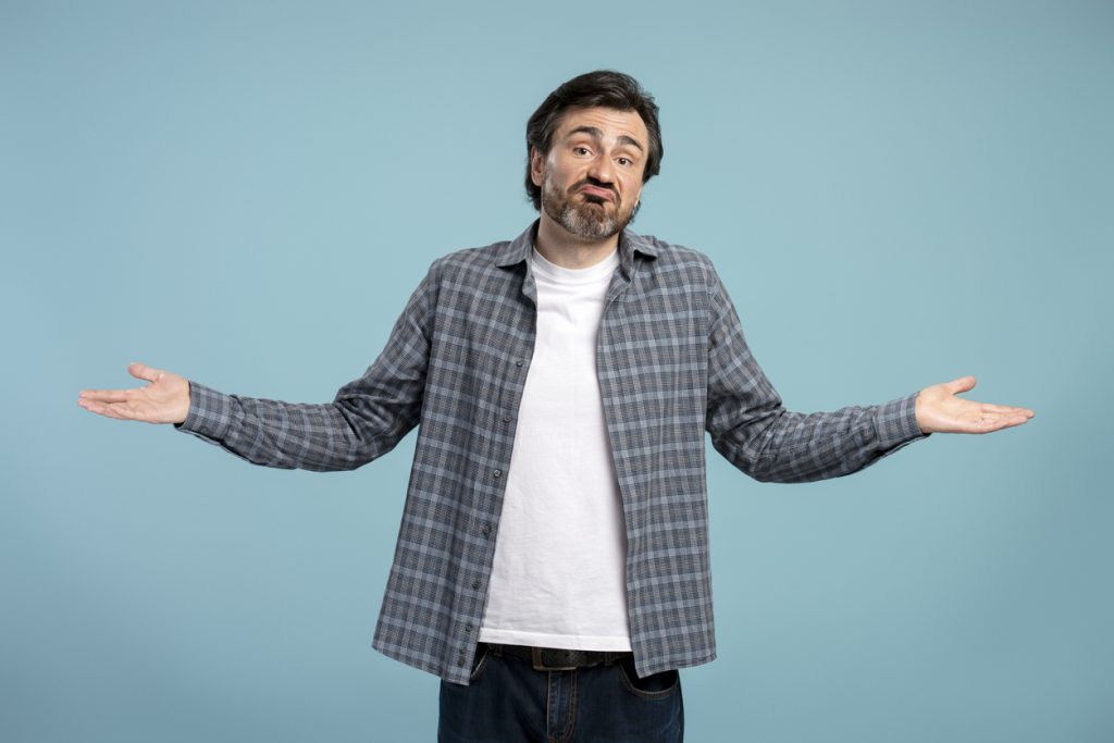 Man shrugging his shoulders, wondering how to handle unsatisfactory cleaning