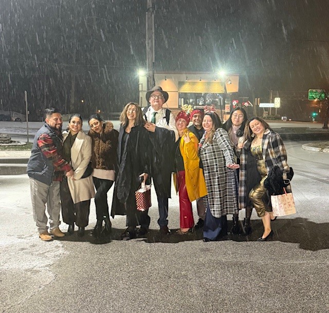 Maid Brigade employees in snowy parking lot after Christmas party