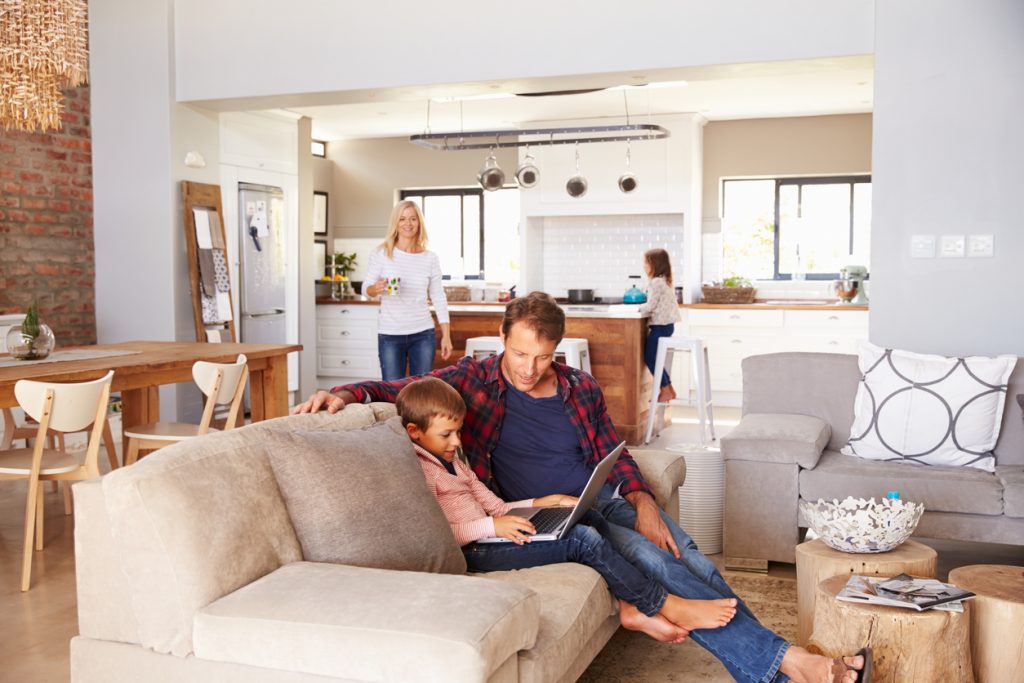 Family relaxing in a tidy home, showing the psychology of a tidy home and mental clarity